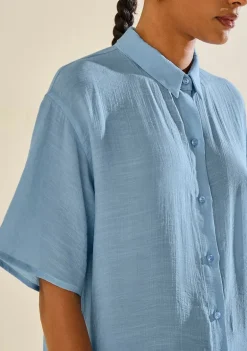 Camisa Morena Rosa Solta Gola Clássica Manga Curta Alongada Azul