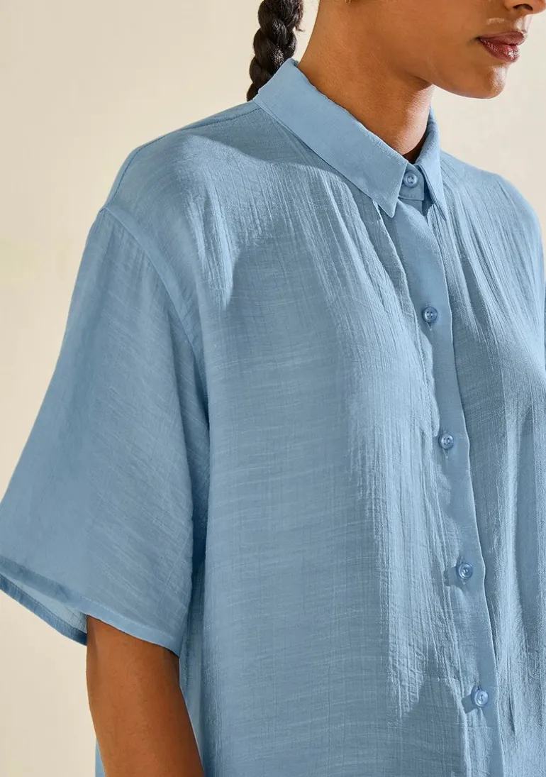 Camisa Morena Rosa Solta Gola Clássica Manga Curta Alongada Azul